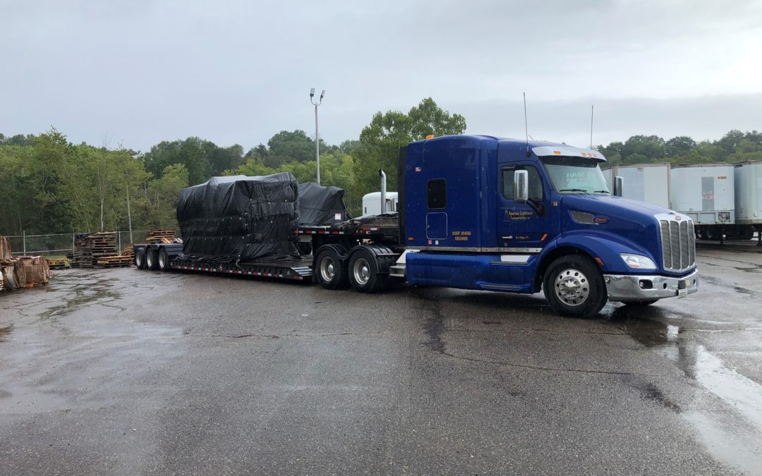 American Lighthouse Transportation Hauls Overweight Injection Molding Machine Clamp From Cambridge, Ohio to Lexington, Tennessee. See Pics…